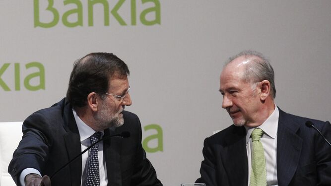 Mariano Rajoy y Rodrugo Rato durante una conferencia en Madrid en marzo de 2012.